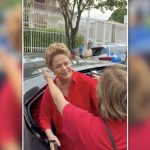 Dilma vota em BH e é recebida por apoiadores aos gritos