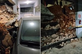 Parte de muro de condomínio, em BH, cai e atinge dois carros em estacionamento